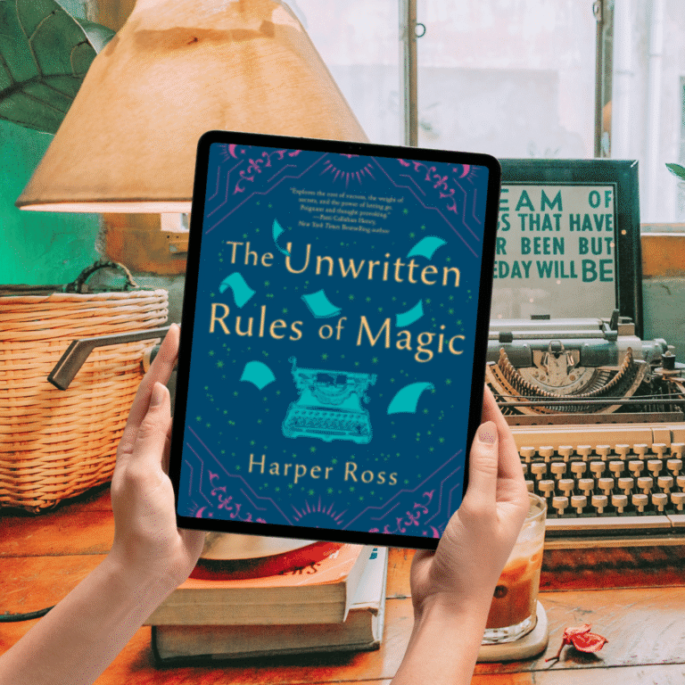 Ereader being held up by woman's hands background is a writers desk with typewriter